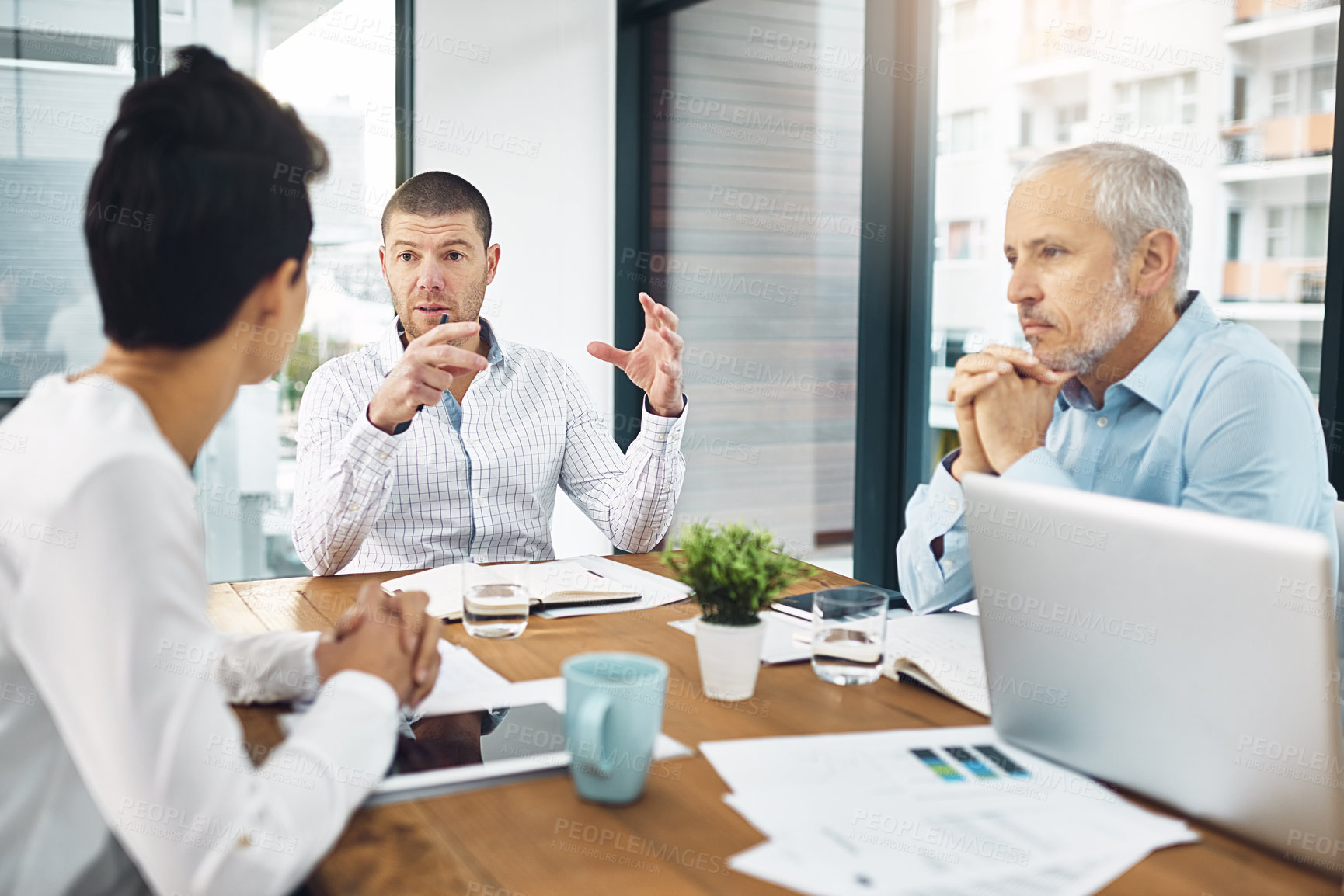 Buy stock photo Business, team and talking or planning in office meeting together, laptop for research with employee brainstorming. Tech, conversation and company project, corporate strategy for collaboration