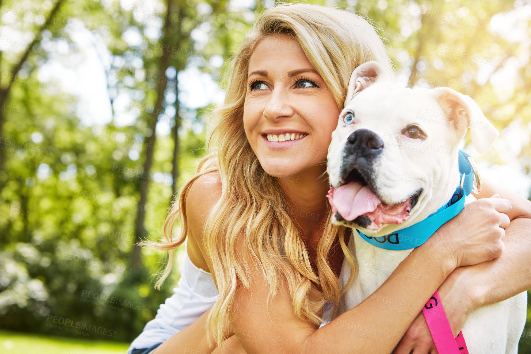 Buy stock photo Shot of a young woman spending time with her dog at the park