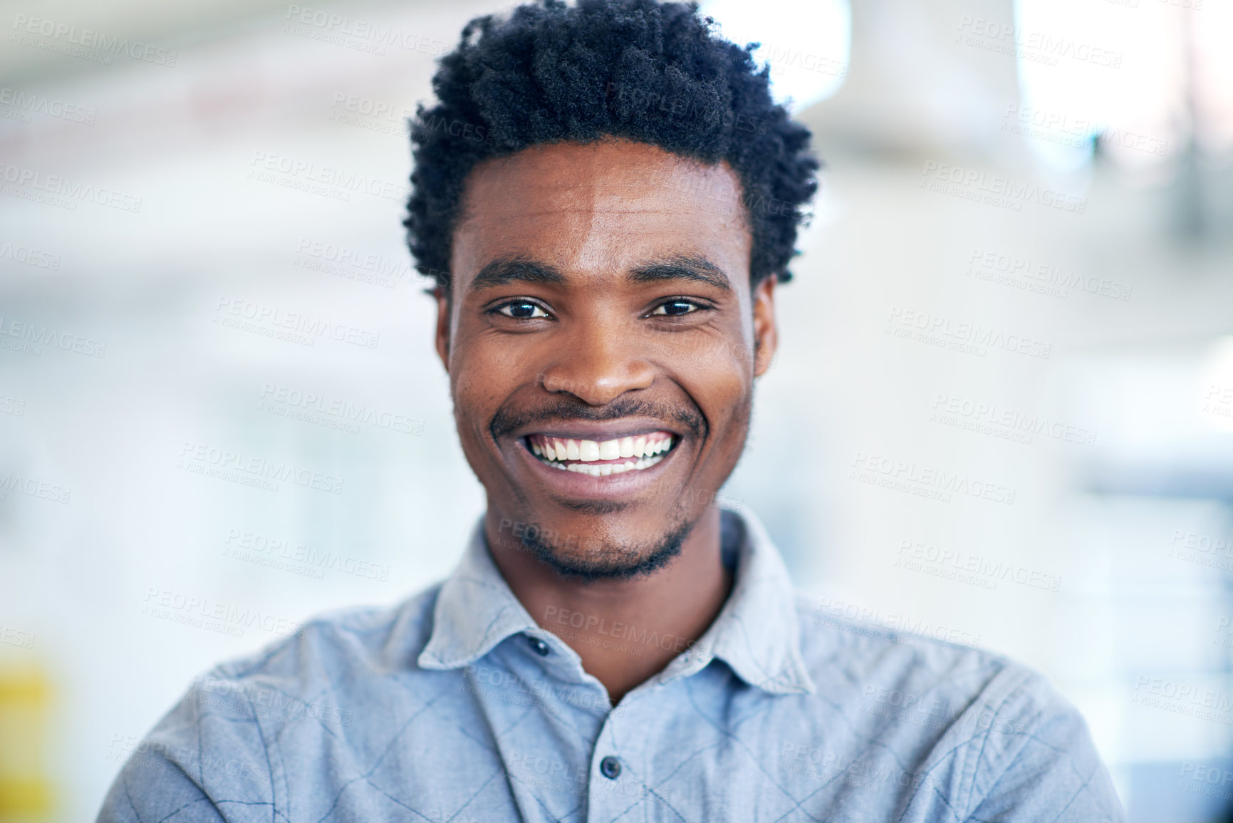 Buy stock photo Portrait of a handsome young businessman in his office