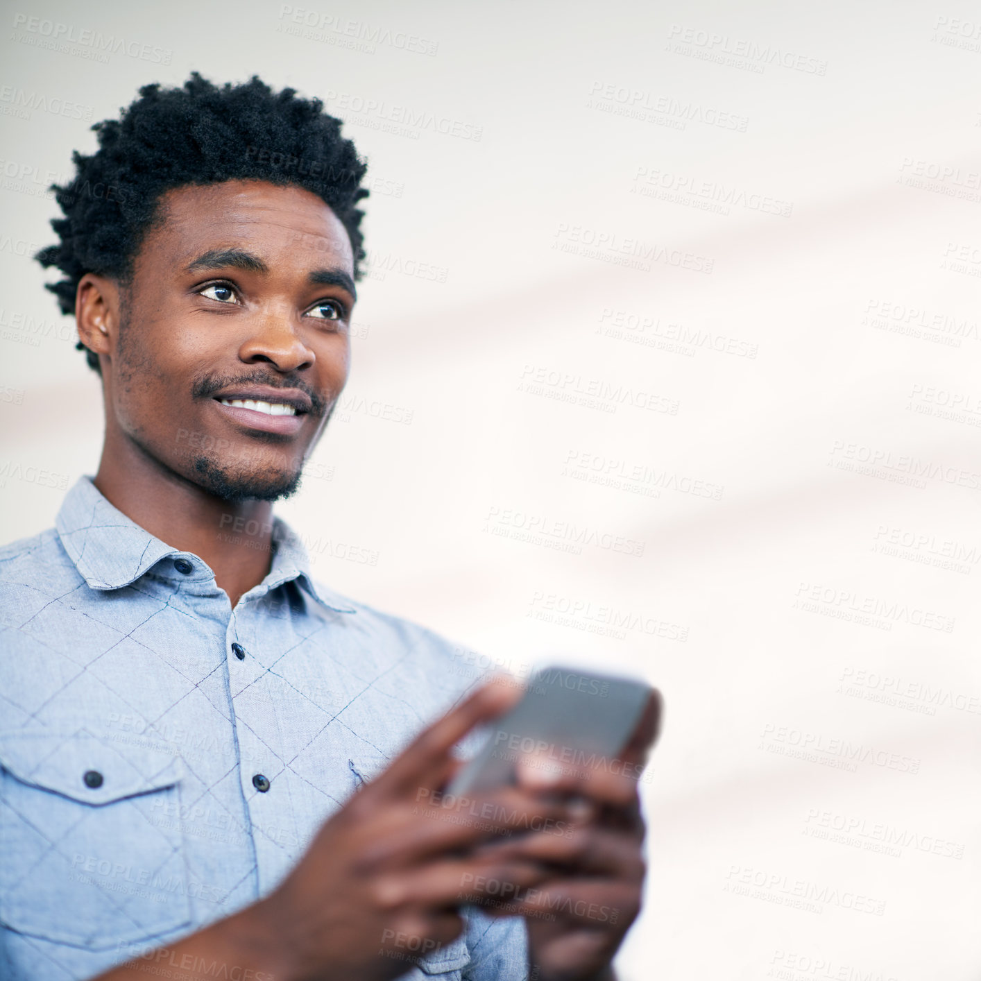 Buy stock photo Businessman, thinking and happy with phone or typing text message, communication or social media post ideas. Professional, black worker or smile with smartphone for mobile chat notification on mockup