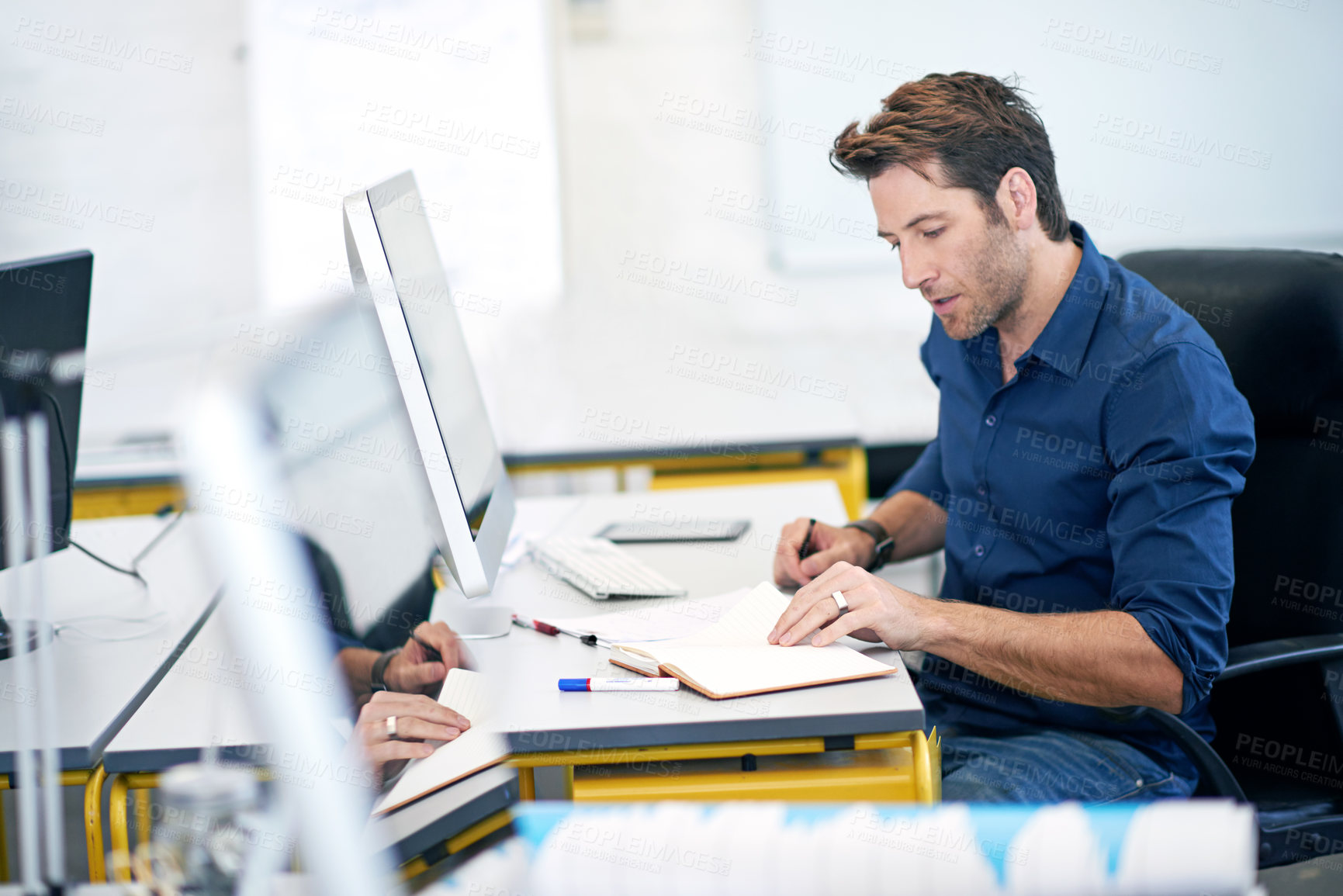 Buy stock photo Business man, notebook and planning in office, ideas and journalist writing for inspiration. Male person, journal and employee for strategy or research at agency, computer and notes for project