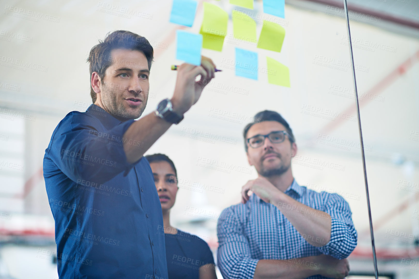 Buy stock photo Glass, wall and man planning with writing in office for team strategy, sticky note and  brainstorming. Creative, moodboard or people with research for mindmap, solution of thinking or problem solving