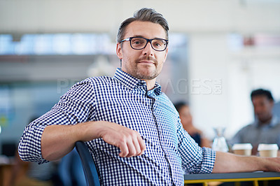 Buy stock photo Portrait of a happy businessman sitting in his office