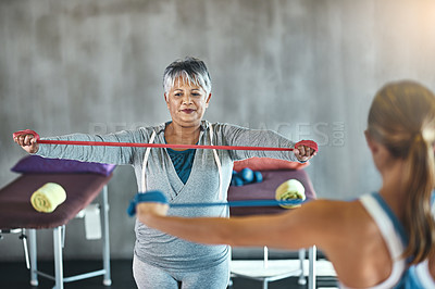 Buy stock photo Physiotherapy, fitness and mature woman with band for training, exercise or stretching workout. Physical therapy, health and physiotherapist with equipment for woman for wellness, health or wellbeing