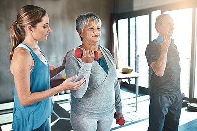 Buy stock photo Physical therapy, dumbbell and senior people in support, help and muscle workout for recovery or health. Exercise, fitness and strength progress of elderly clients in physiotherapy or wellness class