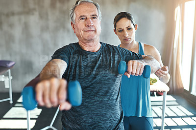 Buy stock photo Physical therapy, dumbbell and support with old man and personal trainer for fitness, health and physiotherapy. Training, weightlifting and coaching with senior patient and physiotherapist for help