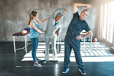 Buy stock photo Stretching, physiotherapy and old couple with personal trainer for fitness, wellness and helping. Health, workout and retirement with senior patient and physiotherapist in class for warm up training