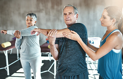 Buy stock photo Stretching, physiotherapy and old man with personal trainer for fitness, wellness or rehabilitation. Health, workout or retirement with senior patient and physiotherapist in gym for warm up training