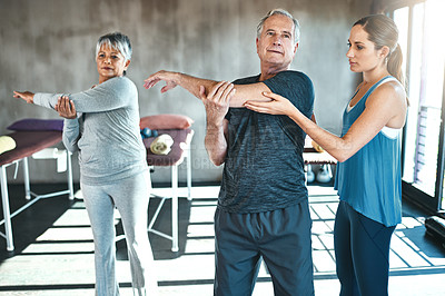 Buy stock photo Stretching, physical therapy and old man with personal trainer for fitness, wellness or helping. Health, workout or retirement with senior patient and physiotherapist in class for warm up training