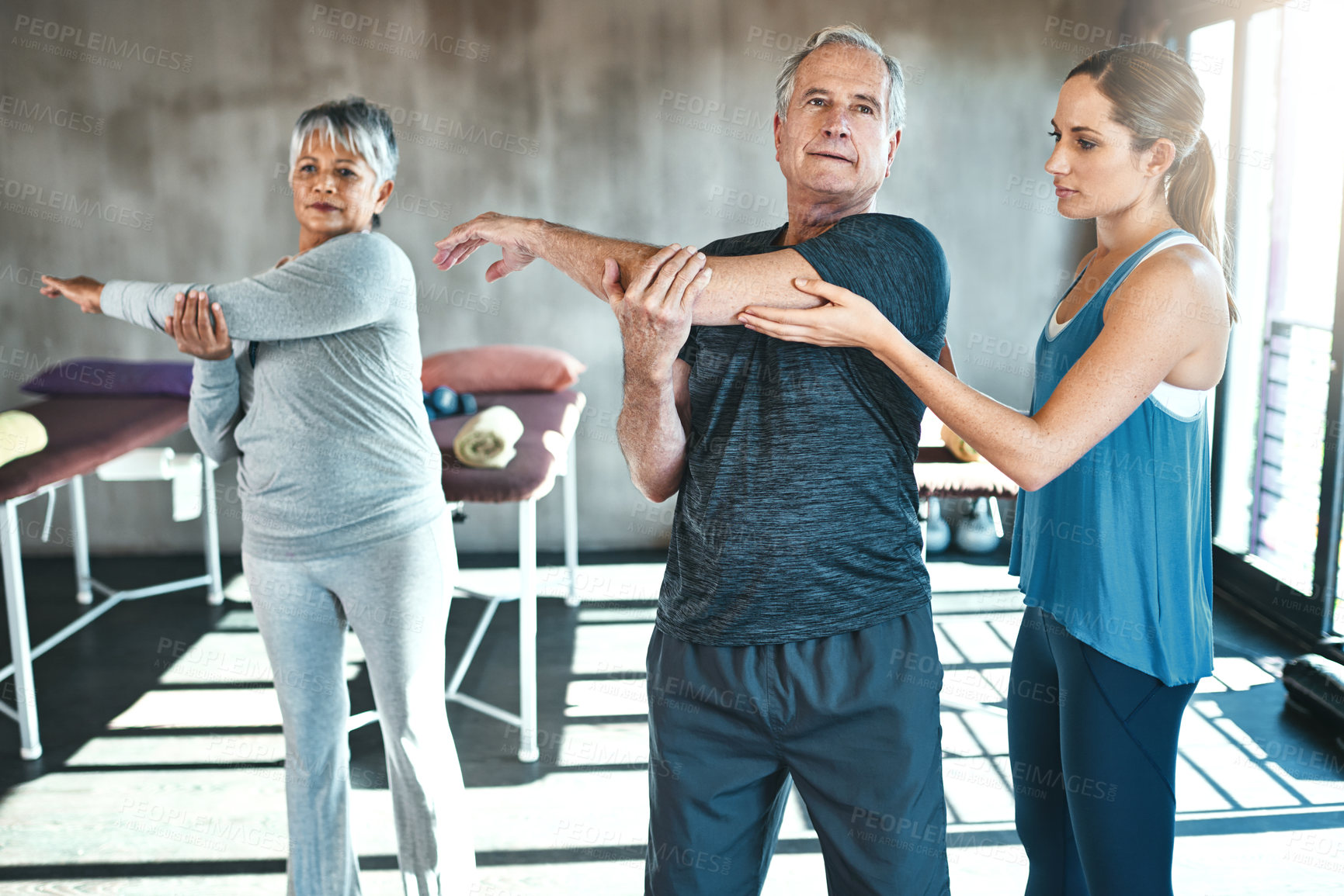 Buy stock photo Stretching, physical therapy and old man with personal trainer for fitness, wellness or helping. Health, workout or retirement with senior patient and physiotherapist in class for warm up training