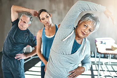 Buy stock photo Stretching, physical therapy and old woman with personal trainer in class for fitness, wellness or rehabilitation. Health, workout or retirement with senior patient and physiotherapist for warm up