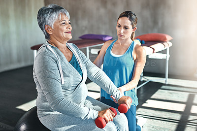 Buy stock photo Old woman, physiotherapy and dumbbell exercise or rehabilitation for injury training, joint pain or inflammation. Senior person, arthritis and muscle mobility on fitness ball, recovery or workout