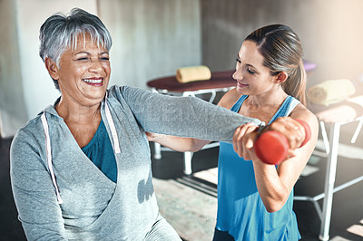 Buy stock photo Old woman, physiotherapy and dumbbell for injury treatment or osteoporosis helping, joint pain or inflammation. Senior person, client and mobility recovery or accident assessment, support or smile