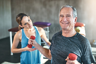 Buy stock photo Portrait, senior and man for physical therapy or fitness for surgical recovery, rehabilitation and pain management of arthritis. Female physiotherapist, dumbbells and exercise ball for physiotherapy.