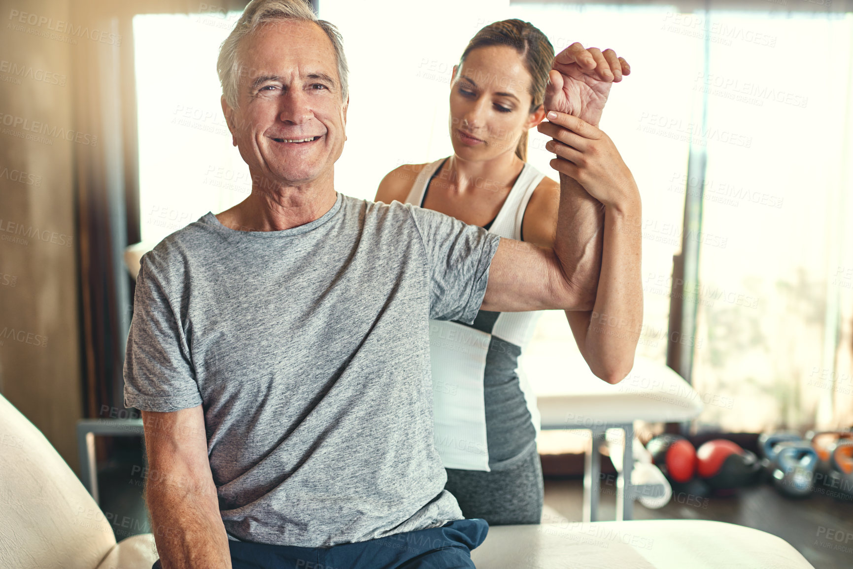 Buy stock photo Old man, physiotherapy and arm or training treatment for rehabilitation, flexibility or assessment. Patient, woman and healing consultation for accident injury or happy with exam, results or help