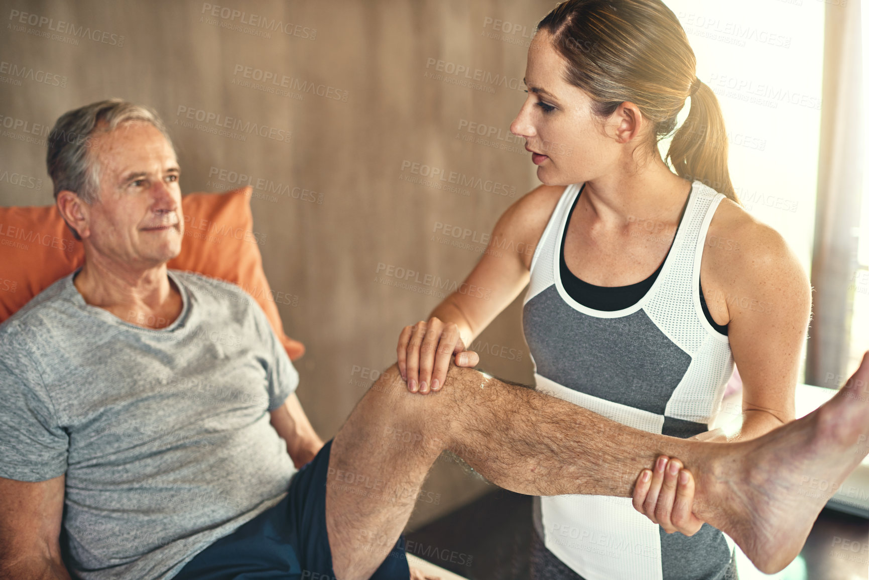 Buy stock photo Physiotherapist, old man and knee pain or joint recovery for inflammation treatment, mobility or flexibility. Woman, client and consultation talking for retirement plan with arthritis, health or leg