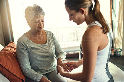 Buy stock photo Physiotherapy, health and senior woman with hand massage for arthritis, joint pain and injury recovery in clinic. Physical therapy, chiropractor and healthcare rehabilitation and osteoporosis support