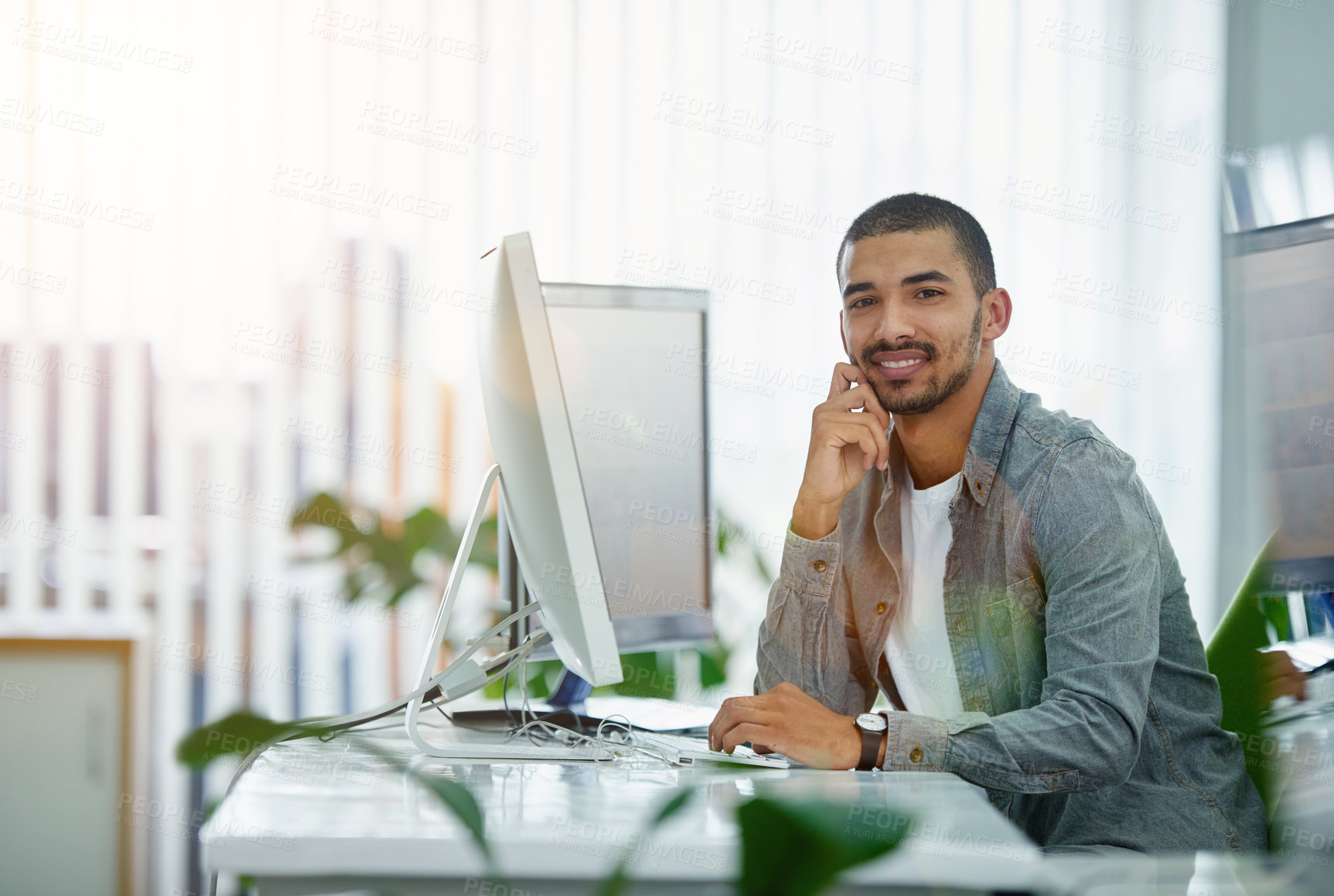 Buy stock photo Portrait of a happy business man typing on a computer, proud while working in a modern office. Confident , checking budget and savings while looking at online data