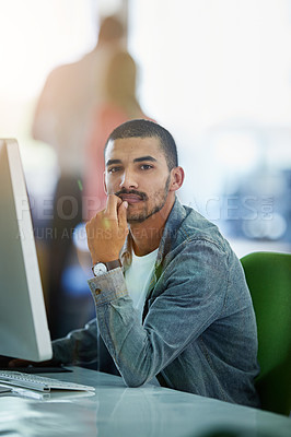 Buy stock photo Modern and serious businessman working on a desktop computer in a busy office at a tech company. Information Technology software engineer expert on data management system for ux and ui website design
