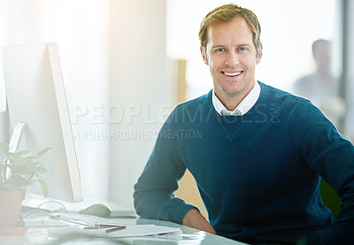 Buy stock photo Portrait of a smiling designer working on a computer in a modern office