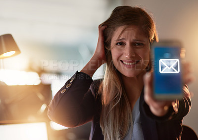 Buy stock photo Portrait of a frantic young businesswoman holding up her cellphone while standing in the office