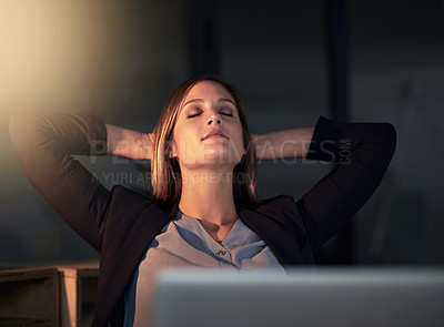 Buy stock photo Shot of a young designer leaning back in her chair with her eyes closed