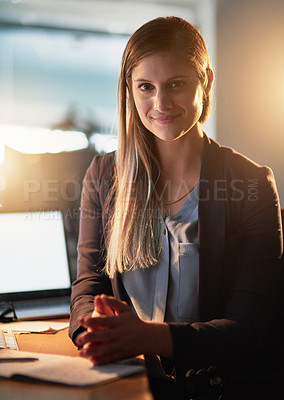 Buy stock photo Portrait of a pretty young designer working late in the office