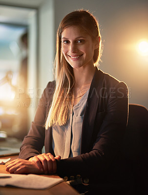 Buy stock photo Portrait of a pretty young designer working late in the office