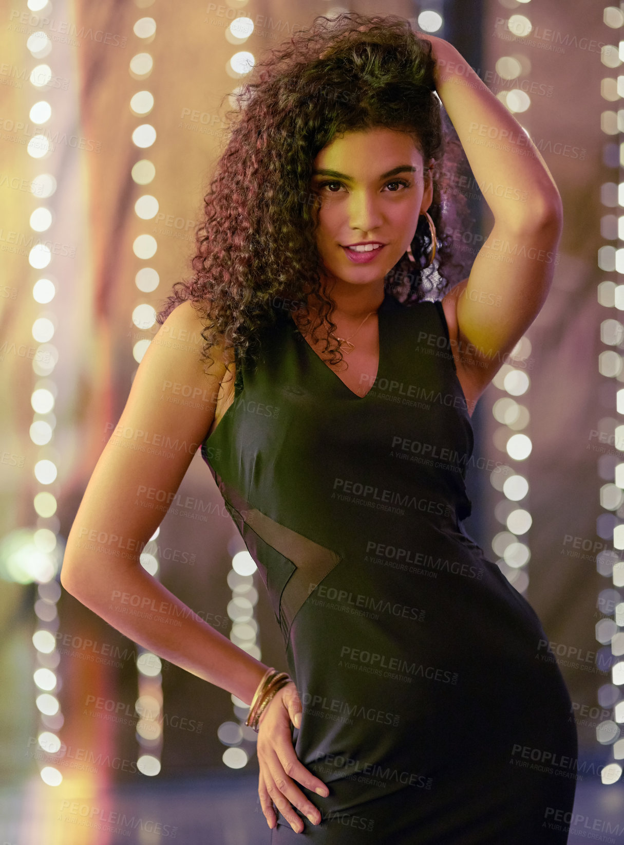 Buy stock photo Portrait of a beautiful young woman dancing in a nightclub