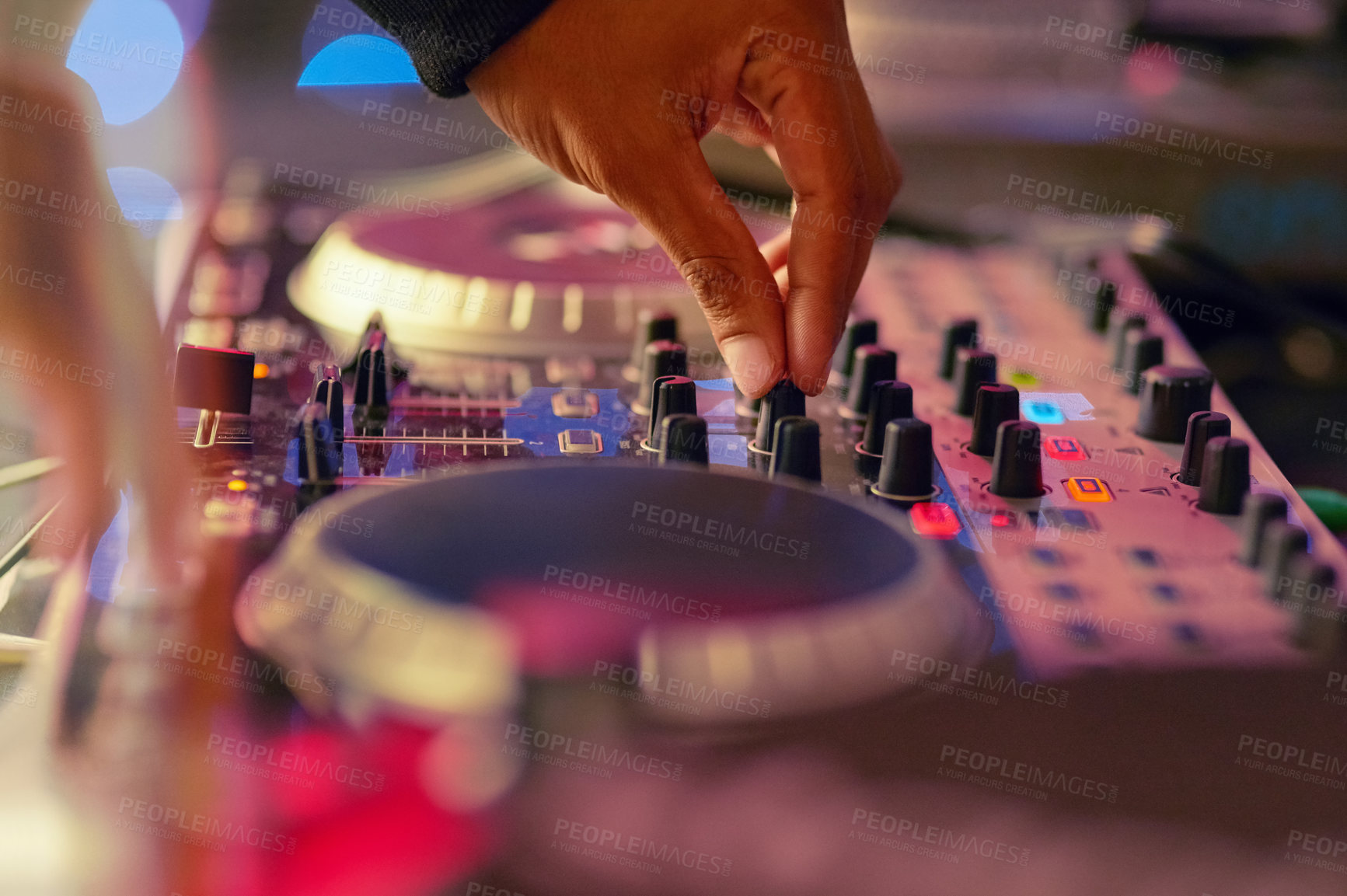 Buy stock photo Closeup shot of a DJ  mixing music on a turntable