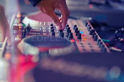 Buy stock photo Closeup shot of a DJ  mixing music on a turntable