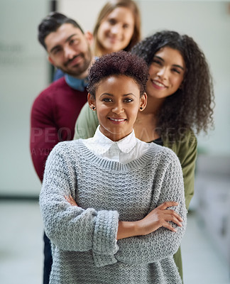 Buy stock photo Portrait of a group of young entrepreneurs standing together in a line in an office