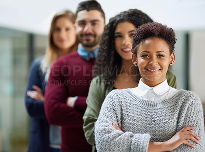 Buy stock photo Portrait of a group of young entrepreneurs standing together in a line in an office