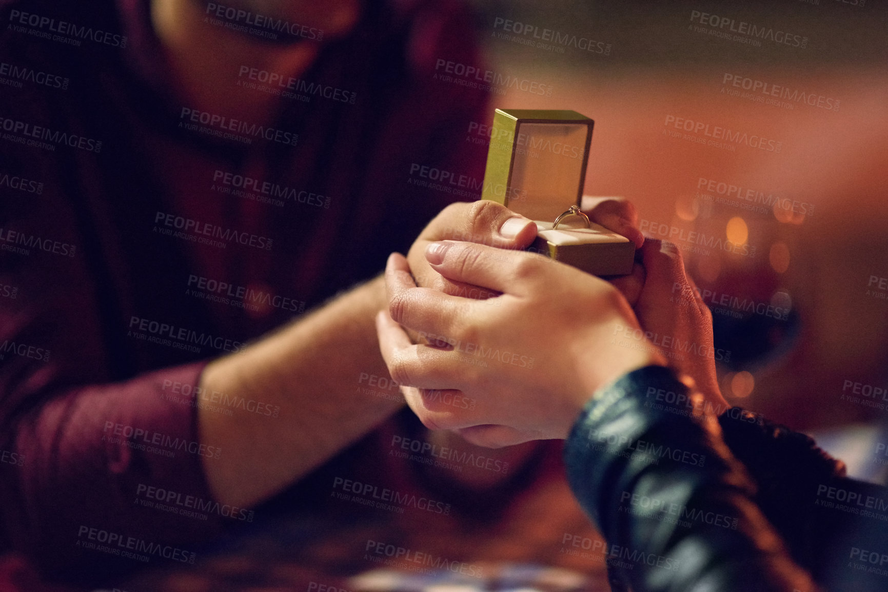 Buy stock photo Cropped shot of a man proposing to his girlfriend with an engagement ring in a box