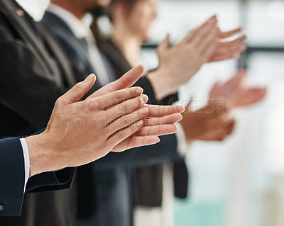 Buy stock photo Closeup shot of a group of executives clapping while standing in a row in an office