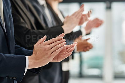 Buy stock photo Closeup shot of a group of executives clapping while standing in a row in an office