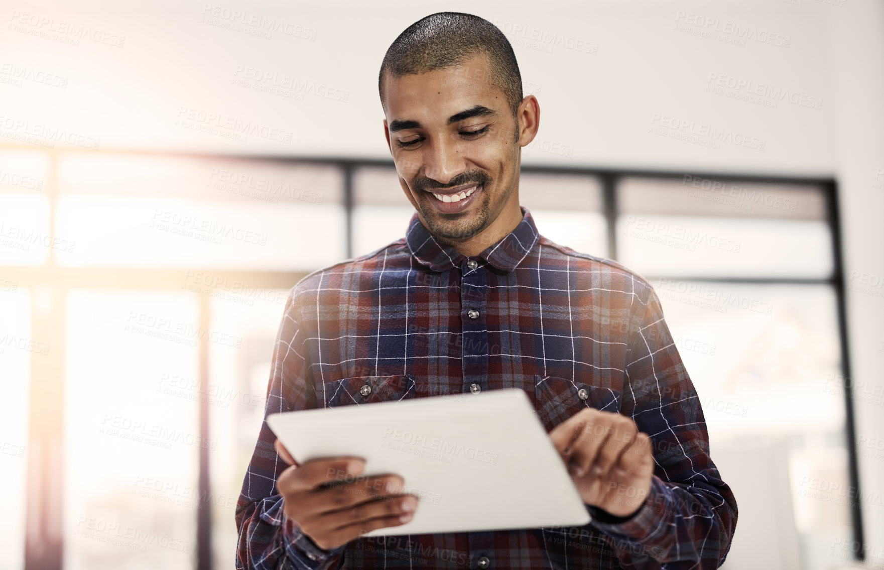 Buy stock photo Employee, man and happy at office with tablet for online reviews, research and insights as social media manager. Male person, business and smile on internet or website for communication or networking