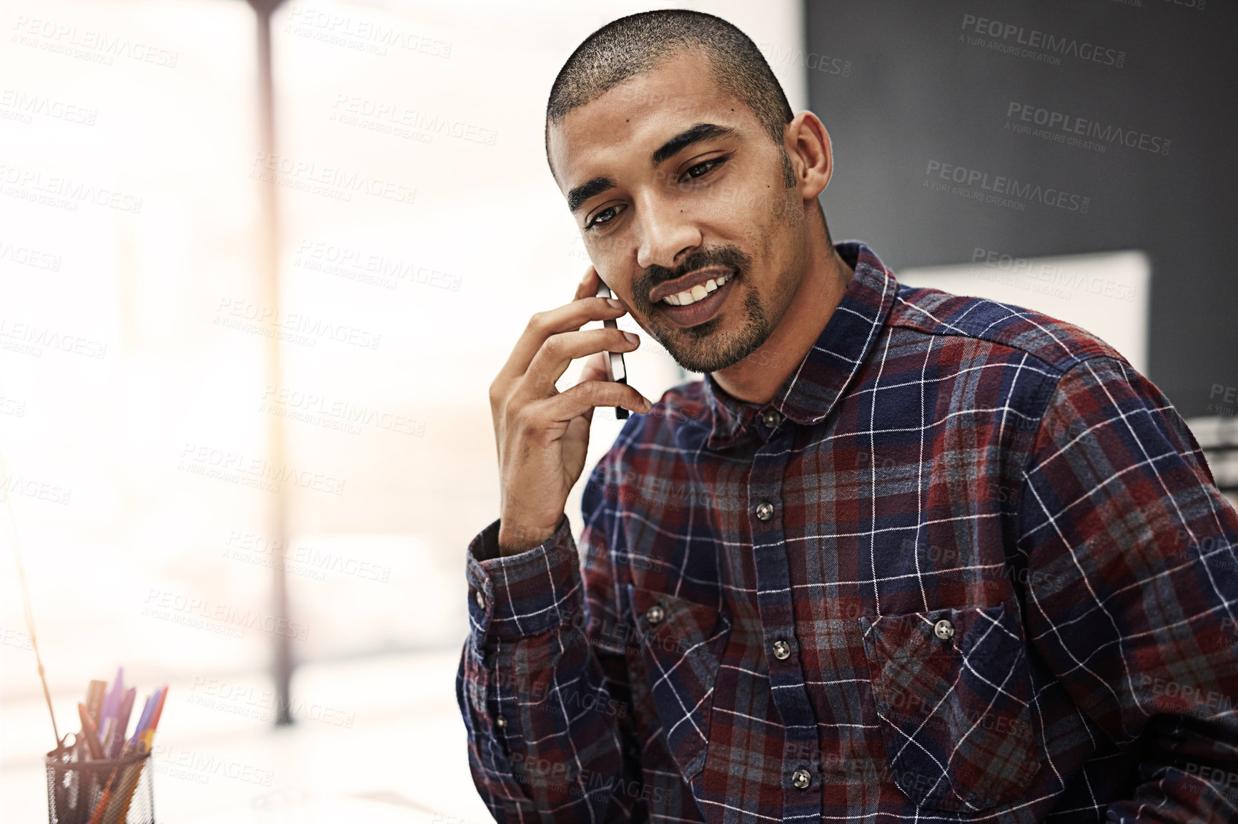 Buy stock photo Business, man and happy at office on phone call for communication and networking as graphic designer. Male person, employee and smile on desk with consultation, connection and advice for creativity