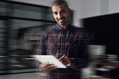 Buy stock photo Portrait of a young entrepreneur working on a digital tablet in an office