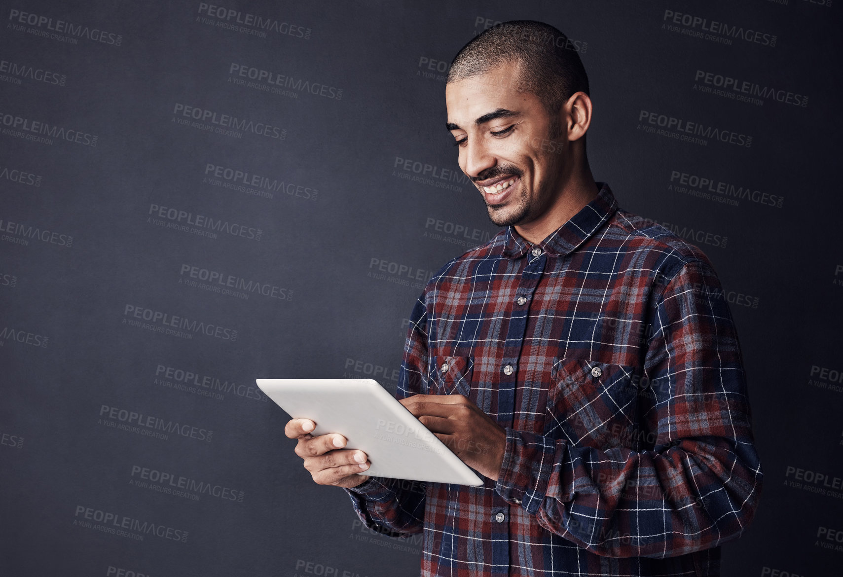 Buy stock photo Tablet, mockup and businessman reading in studio for research, communication and connectivity. Digital tech, contact and male it technician with email for KPI information report by black background.