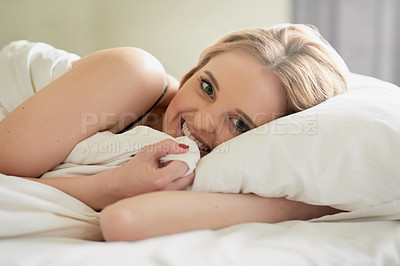 Buy stock photo Portrait of an attractive young woman lying in her bed at home