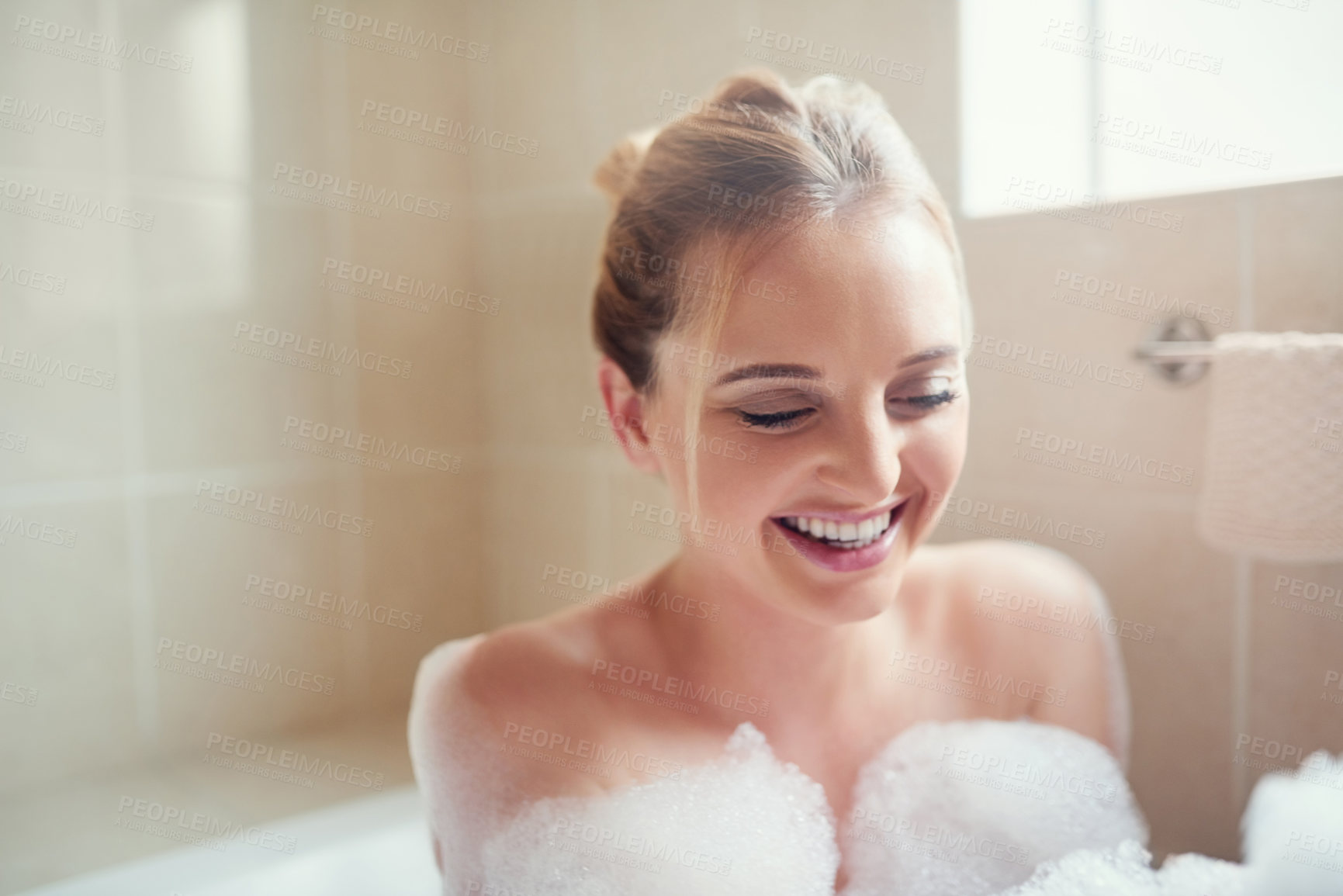 Buy stock photo Woman, bubbles and bathroom tub with smile for hygiene, cleaning and cosmetics for skin in home. Girl, person and washing with soap, foam and relax in water to stop bacteria in morning at house