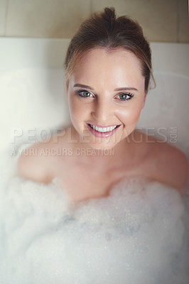 Buy stock photo Portrait of an attractive young woman relaxing in the bathtub