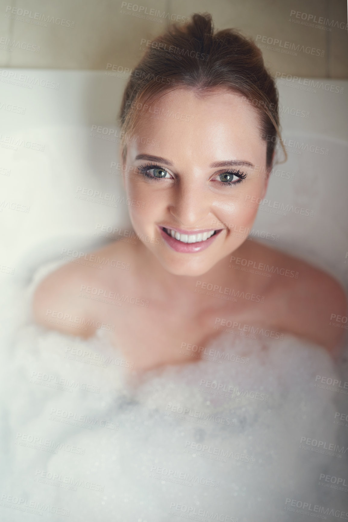 Buy stock photo Woman, bubbles and portrait in bathroom tub for hygiene, cleaning and cosmetics with wellness in home. Girl, person and washing with soap, foam and happy in water to stop bacteria in morning at house
