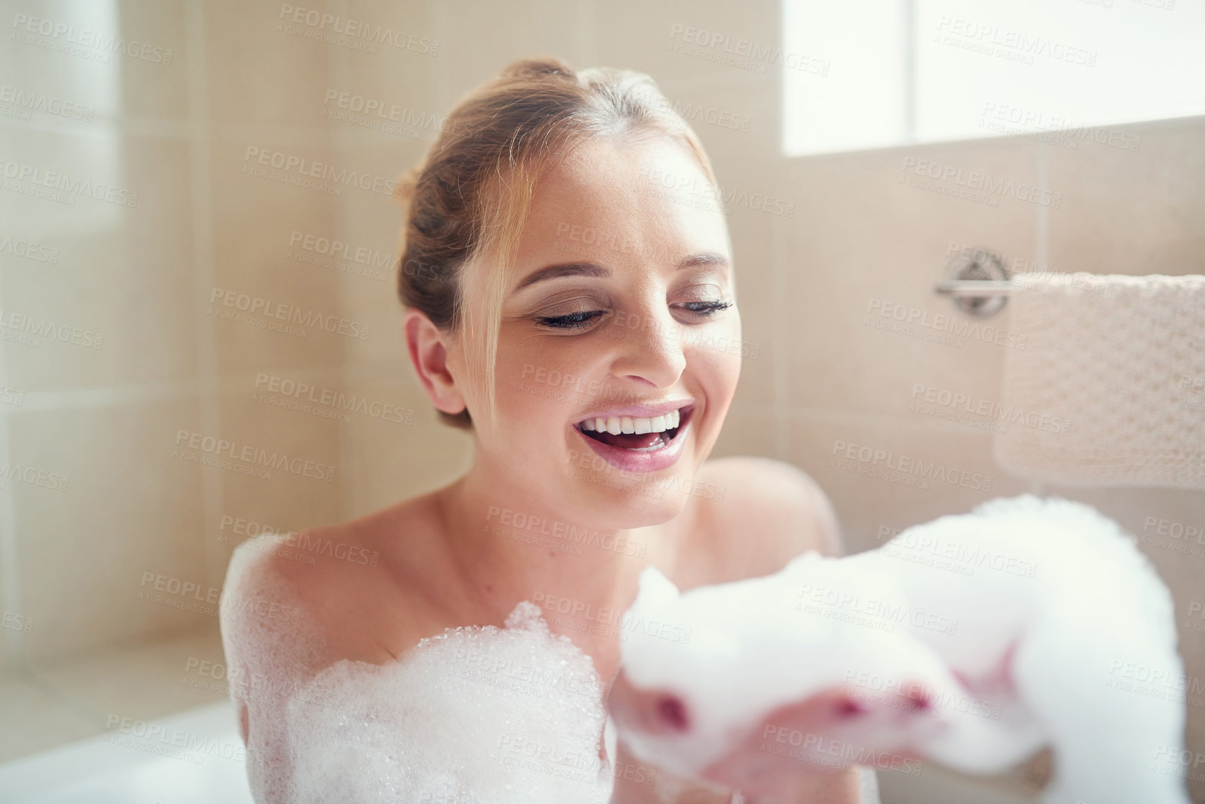 Buy stock photo Woman, bubbles and bathtub with smile for hygiene, cleaning and cosmetics for skin in home. Girl, person and washing in bathroom with soap, foam and relax in water with thinking in morning at house