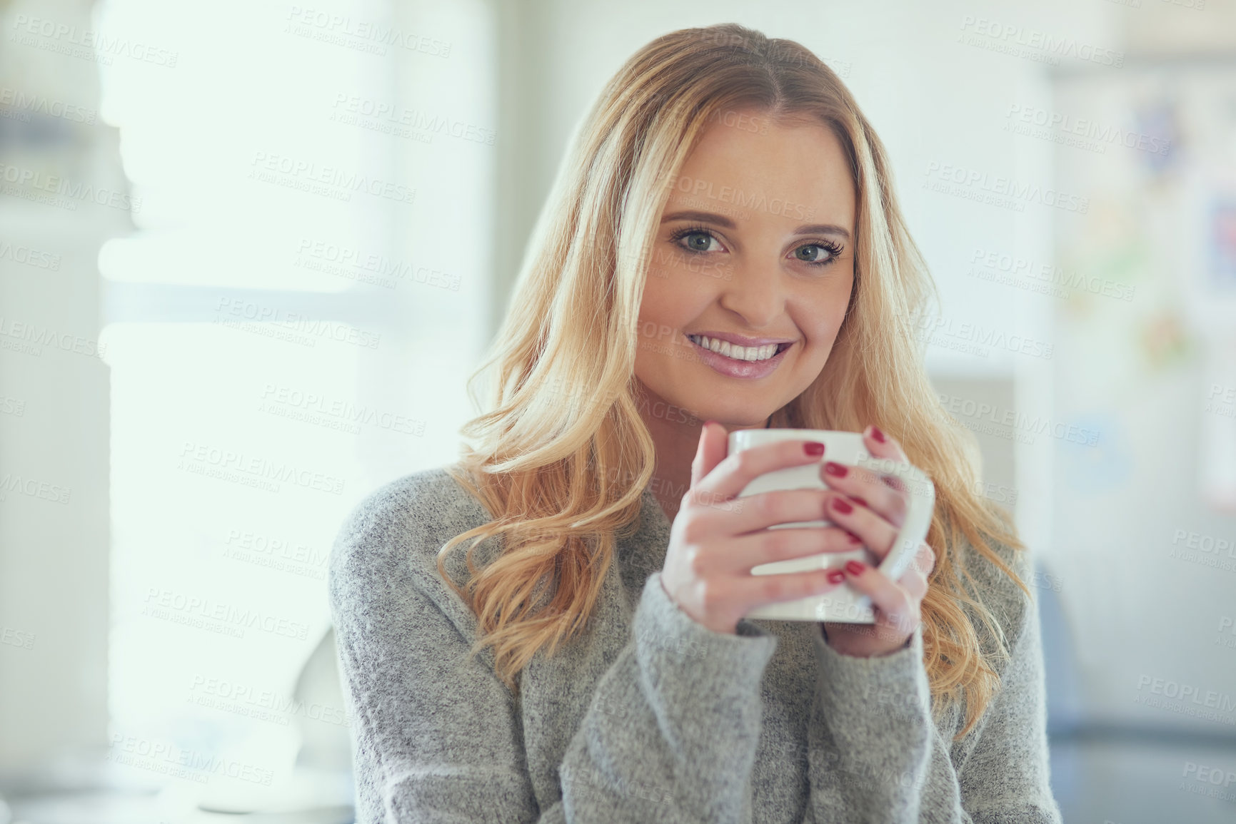 Buy stock photo Woman, happy and coffee in kitchen in morning for breakfast, caffeine or comfortable portrait in home. Girl, person and smile with warm beverage for energy, start day and routine with relax in house