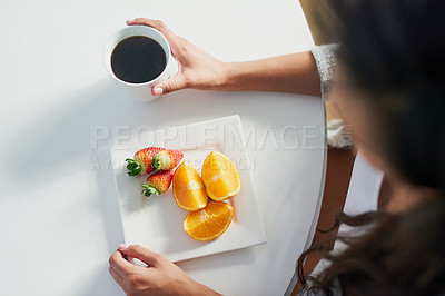 Buy stock photo Shot of an unrecognizable enjoying a breakfast of coffee and fruit
