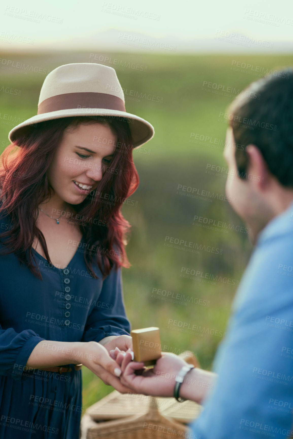 Buy stock photo Couple, engagement ring and proposal in field with love, surprise or commitment to future together in countryside. Man, woman and vacation with jewelry for question, wow and marriage offer in spring