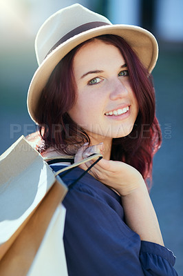 Buy stock photo Woman, shopping bag and happy in city for portrait with fashion, fedora or discount sale from mall. Girl, person and smile for package, clothes and outdoor on metro sidewalk with trendy hat in summer