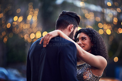 Buy stock photo Embrace, romantic and interracial couple in the city for a date, anniversary or valentines day in France. Love, romance and man and woman embracing for affection, care and hug on a honeymoon at night